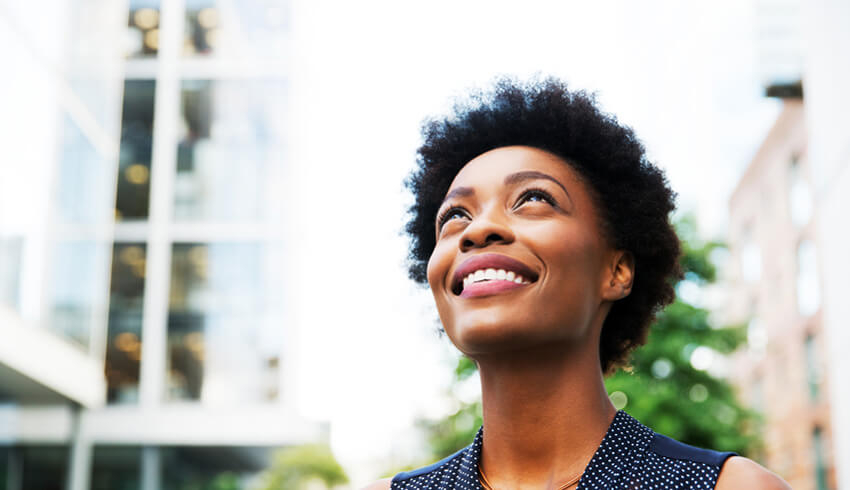 A black woman smiling